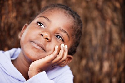 shallow DOF of african child in a dreamy position